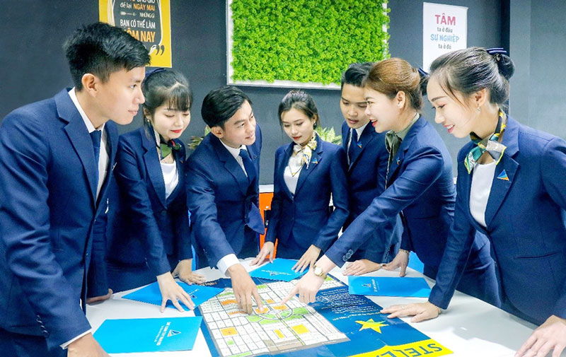 Đồng phục áo vest xanh dương đậm Đất Xanh Group