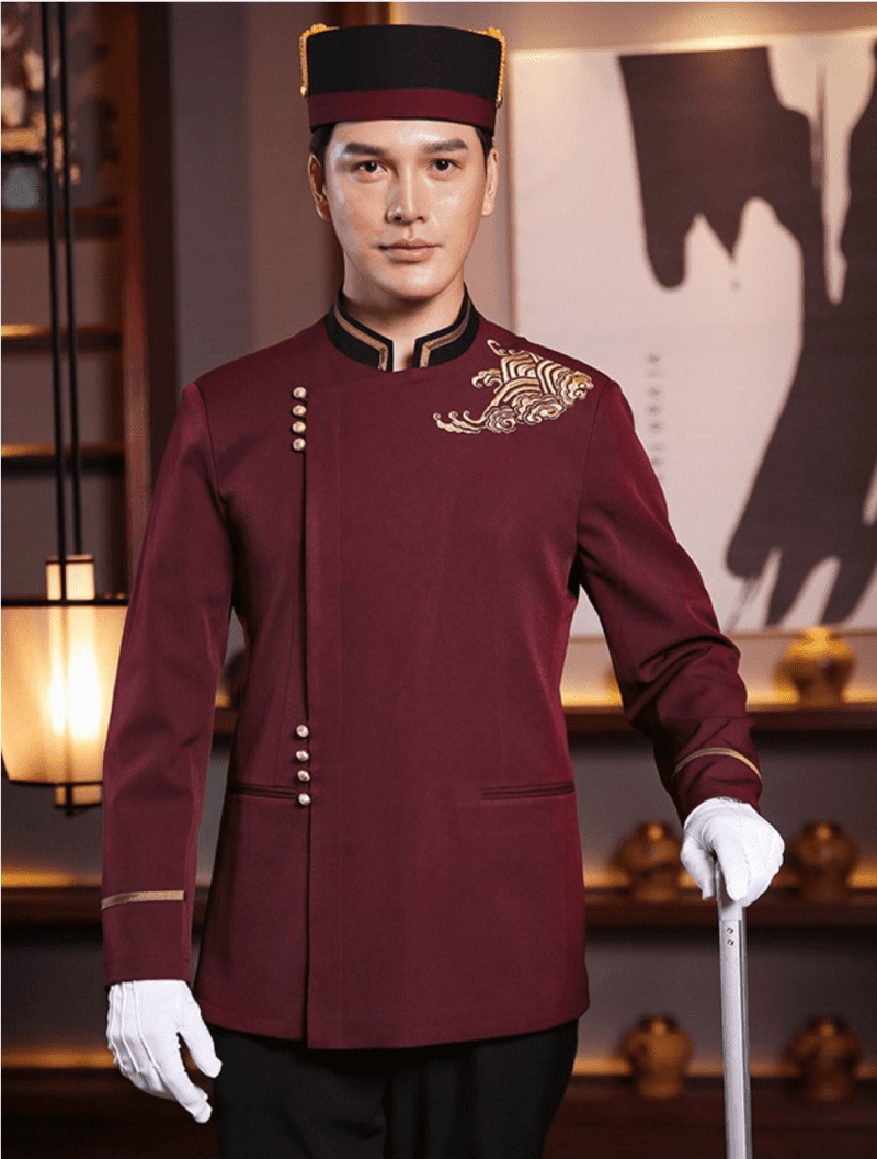 Đồng phục Bellman màu đỏ đô thêu hoa văn vai trái, cổ đứng form Regular Fit vải Lacoste