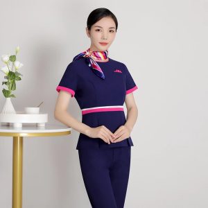 Đồng phục lễ tân spa màu xanh viền hồng phối khăn, form Slim Fit, vải Microfiber